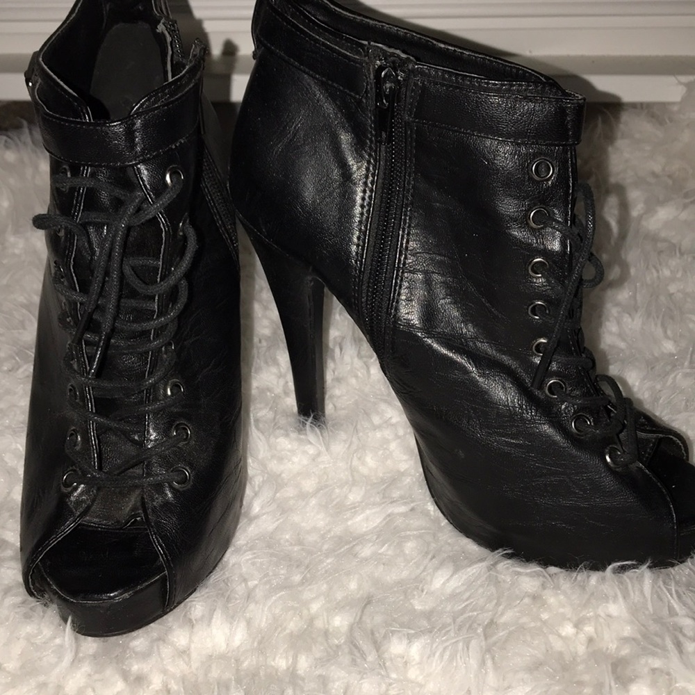 Black lace up booties.